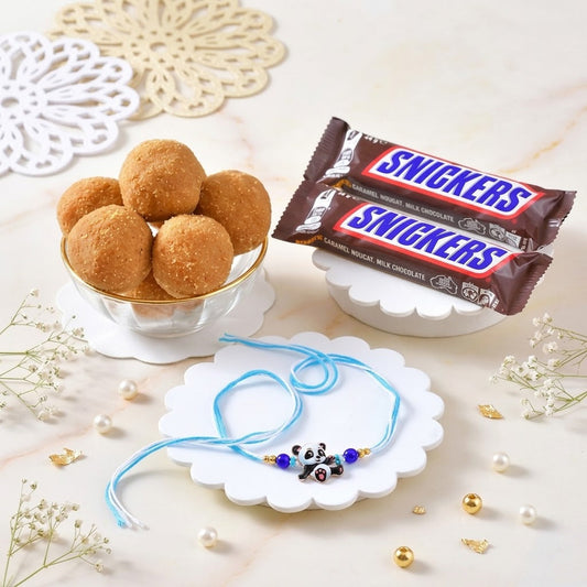 Adorable Panda Rakhi Gift Set with Snicker Chocolate & Besan Laddoo