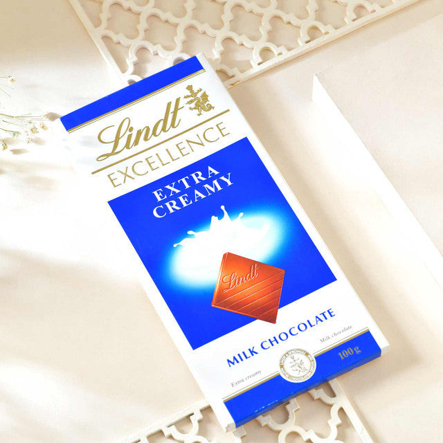 Protective Evil Eye Rudraksha Rakhi with Lindt Extra Creamy Milk Chocolate