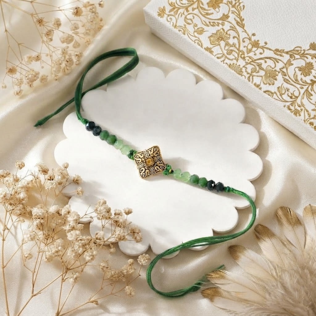 Blessed Golden Mantra Rakhi with Assorted Nuts