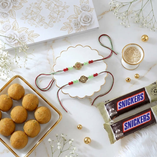 Emerald Bloom Rakhi With Besan Laddu & Snickers Chocolate